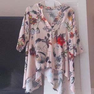 Beautiful flowy top.shorter in front.
